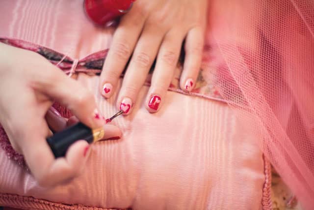 painting-fingernails-nail-polish-hearts