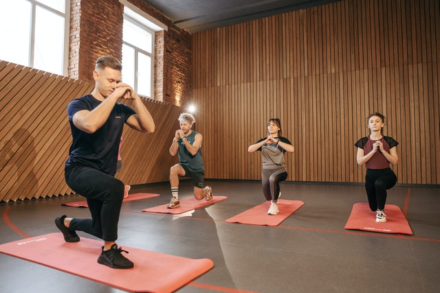 A boy fitness trainer, training few girls